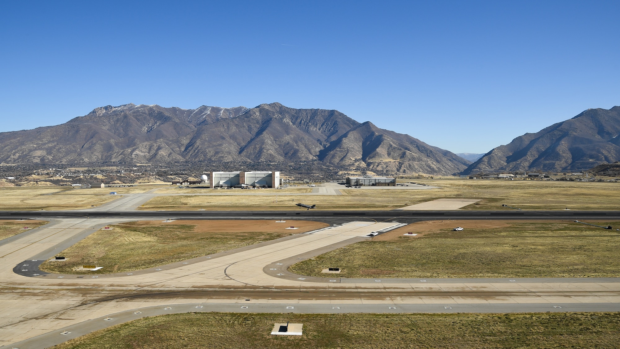 An F-35A Lightning II takes off from the base's newly resurfaced runway Nov. 5, 2019, at Hill Air Force Base, Utah. A nine month, $44.6 million construction project providing major repairs to the runway was completed this month. In addition to complete asphalt rehabilitation, the 13,500-foot runway received wider shoulders, a widened taxiway on the south end, new overruns, new airfield signs, and new electrical wiring and new airfield lighting. (U.S. Air Force photo by R. Nial Bradshaw)