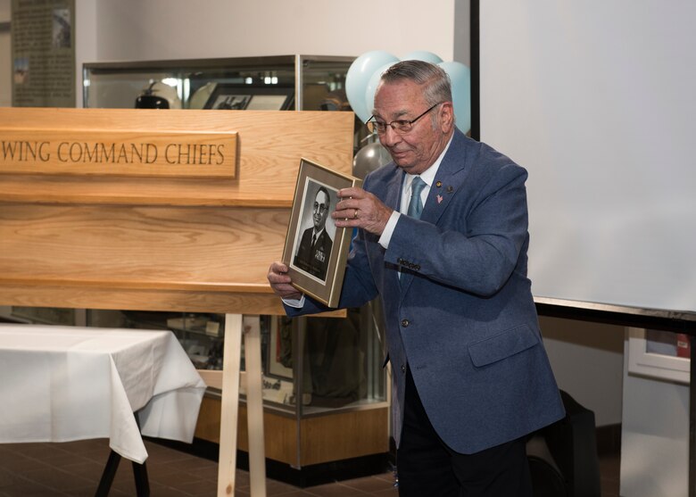 Robert Roberts, former 366th Fighter Wing command chief, presents his legacy plaque at the Chief Legacy ceremony, Nov. 11, 2019, at Mountain Home Air Force Base, Idaho. Robert’s was the first Gunfighter Chief when the Gunfighters received their official name. (U.S. Air Force photo by Senior Airman Tyrell Hall)