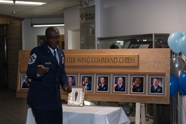 Chief Master Sgt. Wendell Snider, 366th Fighter Wing command chief, engages with a crowd at a ceremony, Nov. 8, 2019, at Mountain Home Air Force Base, Idaho. The ceremony honored prior 366th FW command chiefs and served to launch the first top enlisted advisor ducmentation program on MHAFB. (U.S. Air Force photo by Airman 1st Class Natalie Rubenak