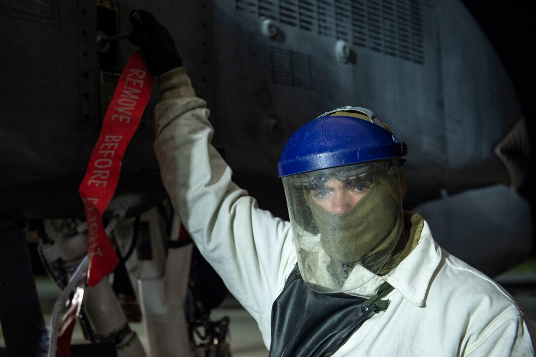 A photo of an Airman performing maintenance with liquid oxygen