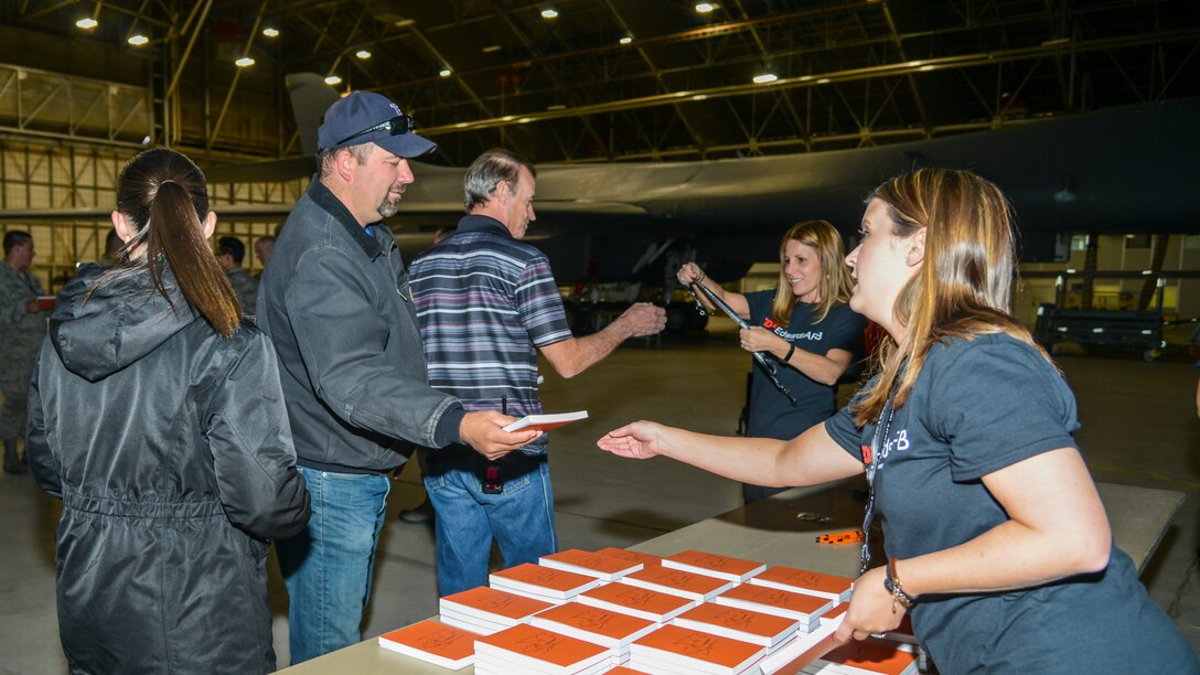 SparkED Team Member Britney Reed and Cherie Head, SparkED Team Lead, hand out Eddie's Challenge 19.2 materials during a, innovation challenge kick-off event at Edwards Air Force Base, Nov. 8. (Air Force photo by Giancarlo Casem)