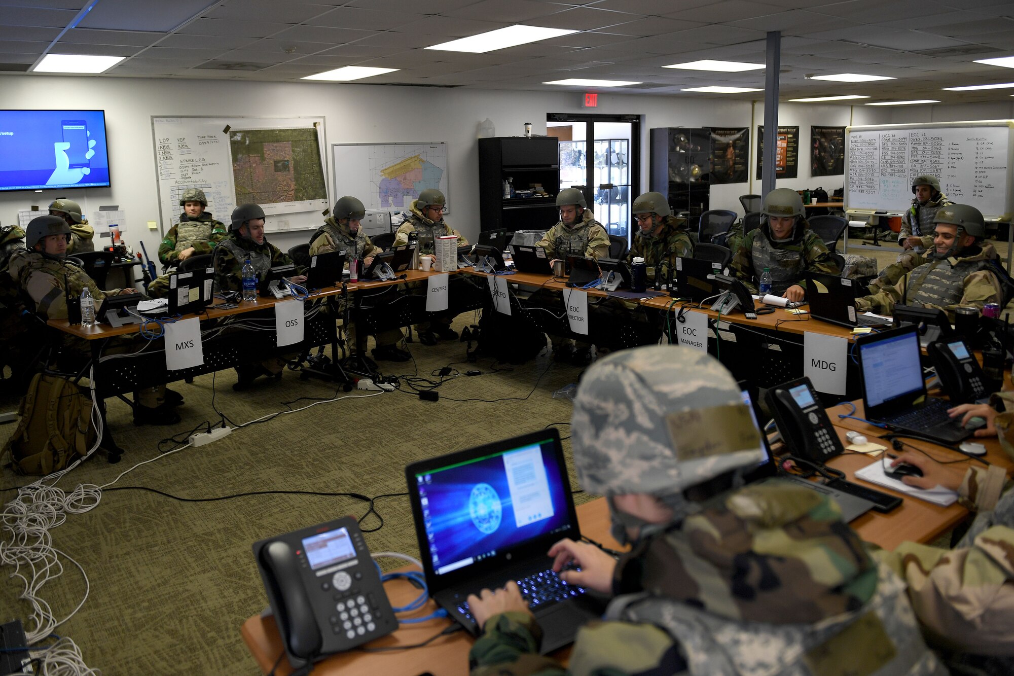 Airmen sits at a large desk