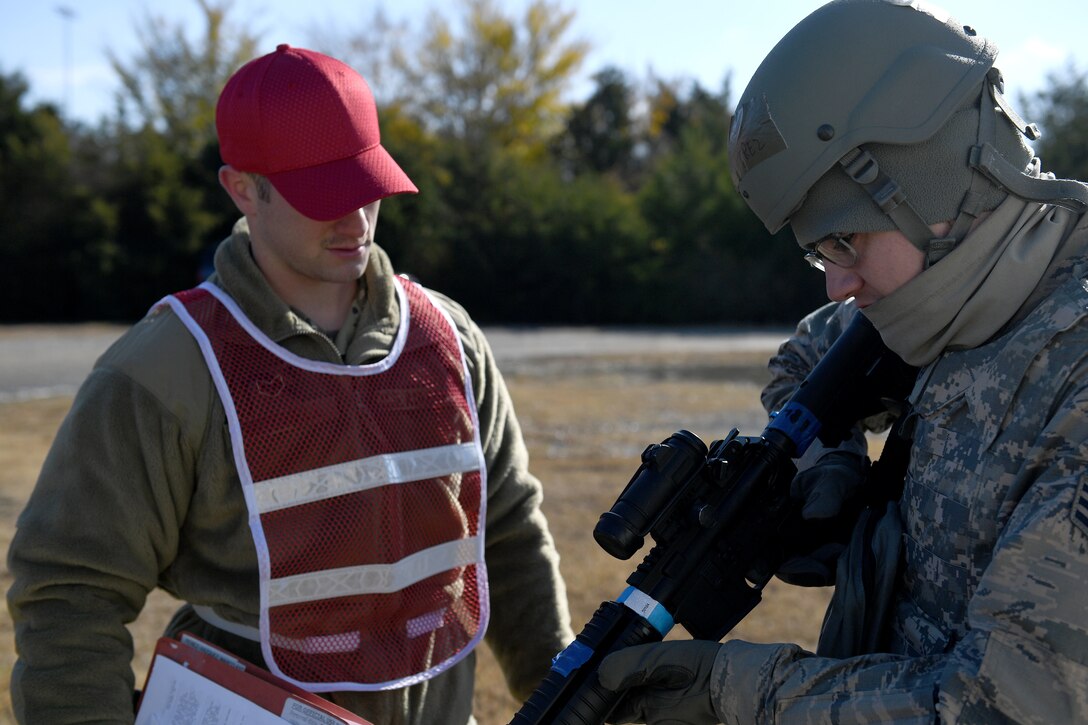 Airmen clear their weapons