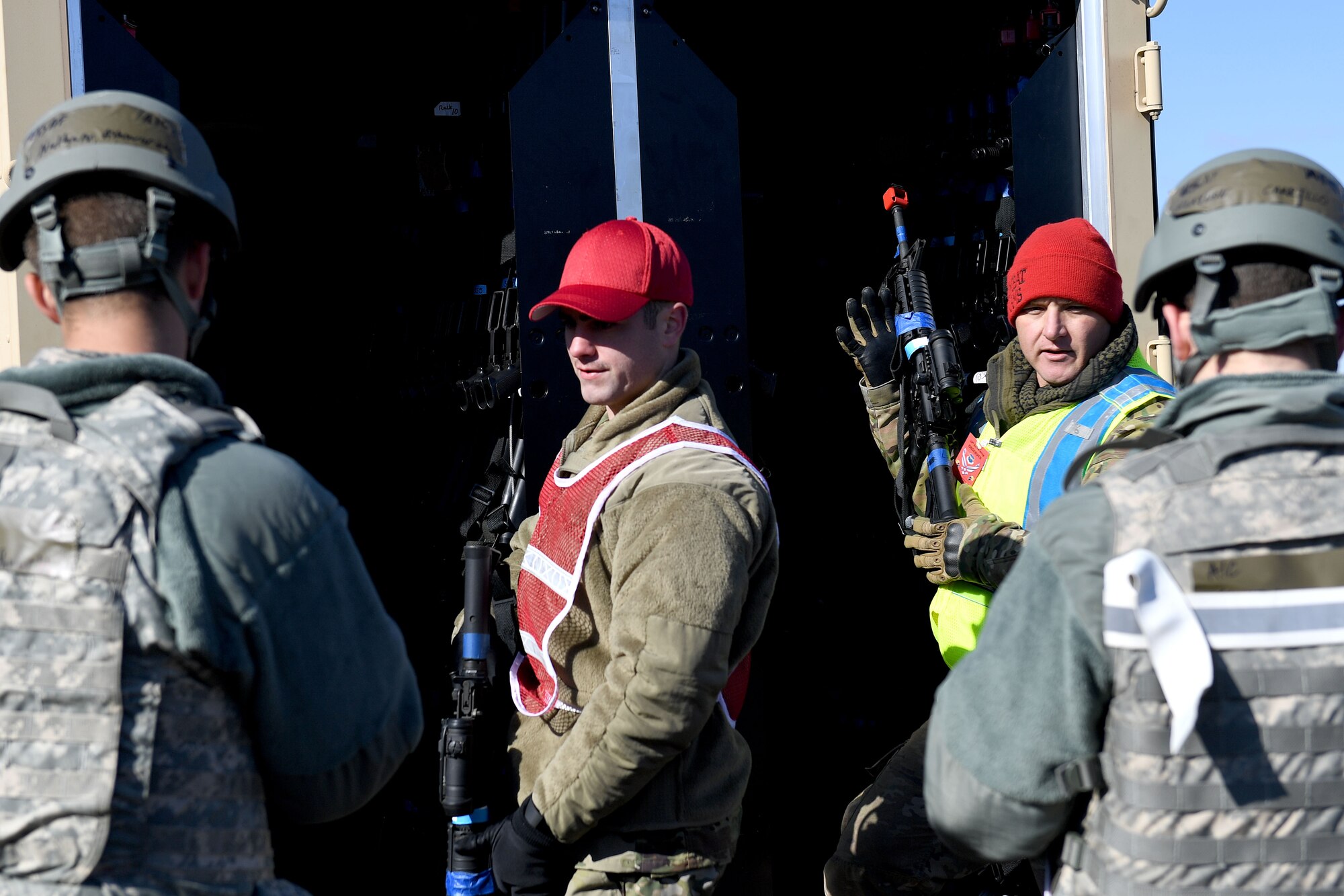 Airmen clear their weapons