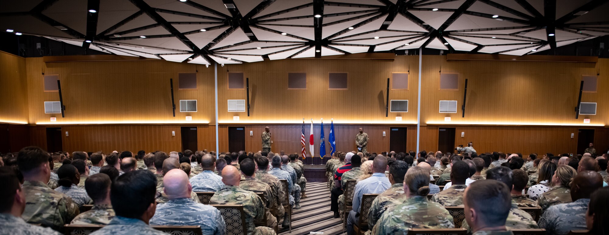 U.S. Air Force Airmen attend an all-call hosted by Gen. CQ Brown, Jr., Pacific Air Forces commander, at Kadena Air Base, Japan, Nov. 12, 2019. During the all-call, Brown recognized Airmen for their outstanding performance and took questions from the audience. (U.S. Air Force photo by Staff Sgt. Benjamin Raughton)