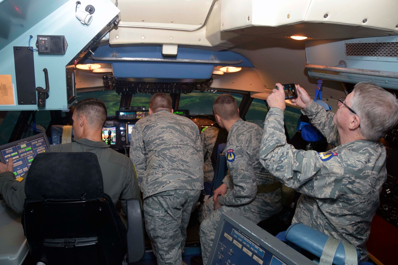 Senior Master Sgt. Brian Mizula, 733rd Training Squadron instructor flight engineer, shows the a C-5M Super Galaxy flight deck simulator to Civil Air Patrol cadets Nov. 6, 2019 at Joint Base San Antonio-Lackland, Texas (U.S. Air Force photo by Staff Sgt. Lauren M. Snyder)