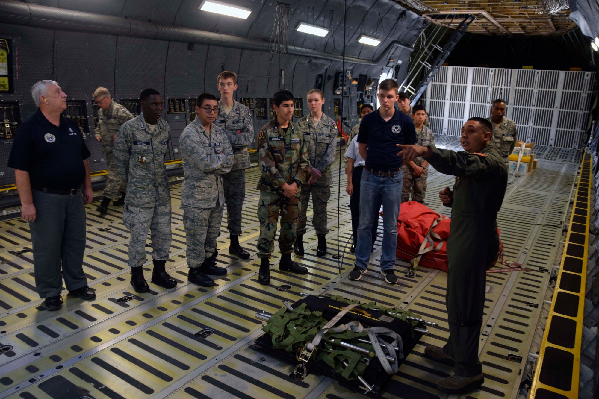 Senior Airman Thomas G. Wawrzyniak, 68th Airlift Squadron loadmaster, talks about the C-5M Super Galaxy’s cargo compartment with Civil Air Patrol cadets Nov. 6, 2019 at Joint Base San Antonio-Lackland, Texas (U.S. Air Force photo by Staff Sgt. Lauren M. Snyder)