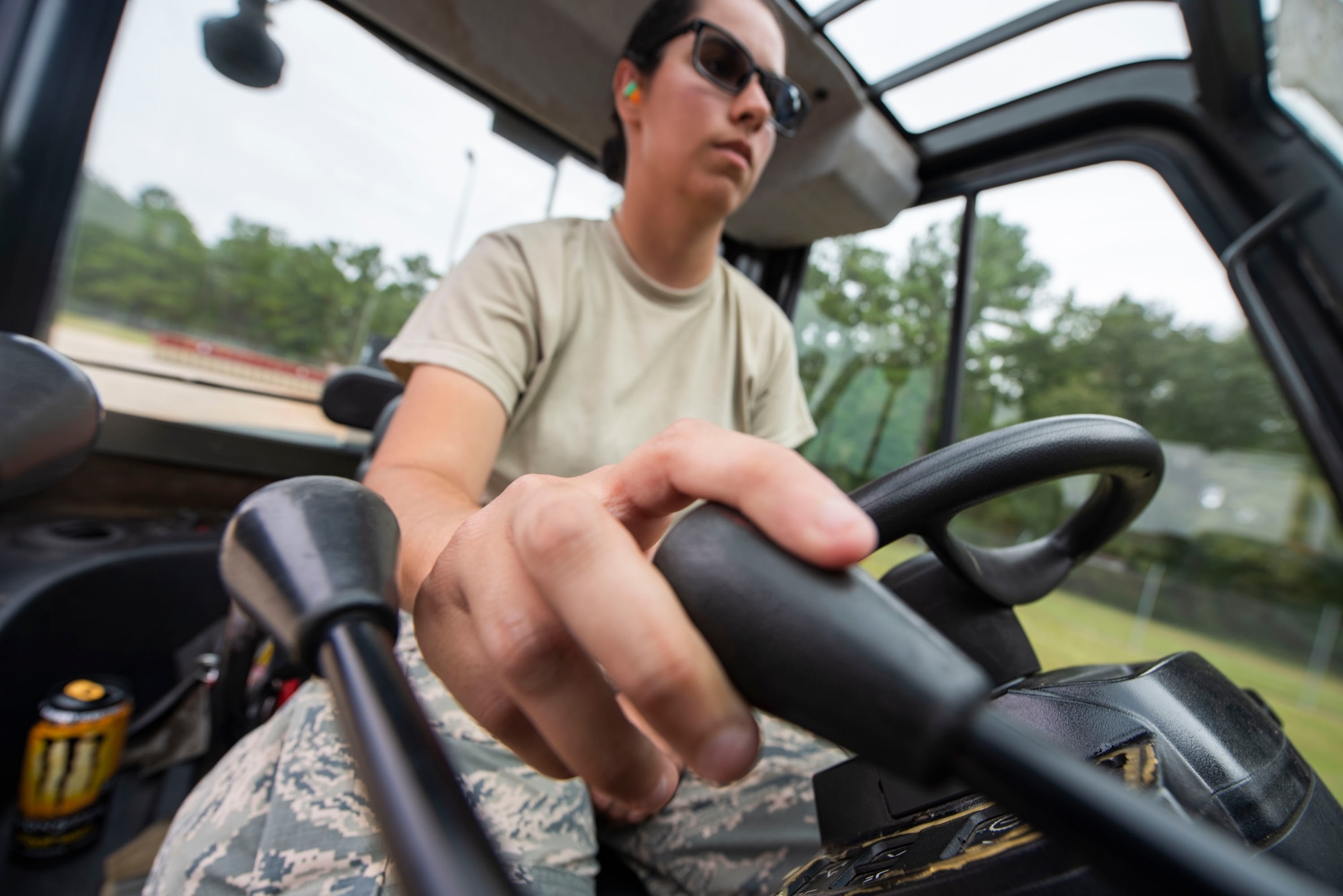 A photo of an Airman operating a forklift