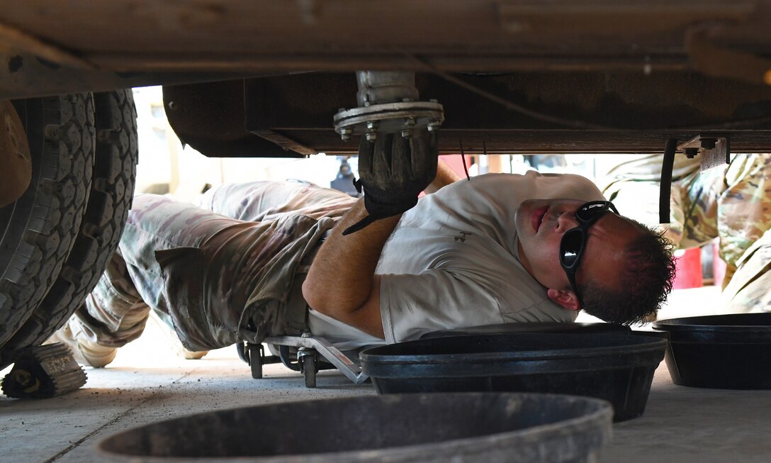 U.S. Air Force Tech. Sgt. James Hopper, 726th Expeditionary Air Base Squadron Vehicle Maintenance flight chief investigates a leak on a C300 refueling truck at Chabelley Airfield, Djibouti, Nov. 8, 2019. Hopper is deployed to Camp Lemonnier, Djibouti, from the 7th Logistics Readiness Squadron at Dyess Air Force Base, Texas. (U.S. Air Force photo by Staff Sgt. Alex Fox Echols III)