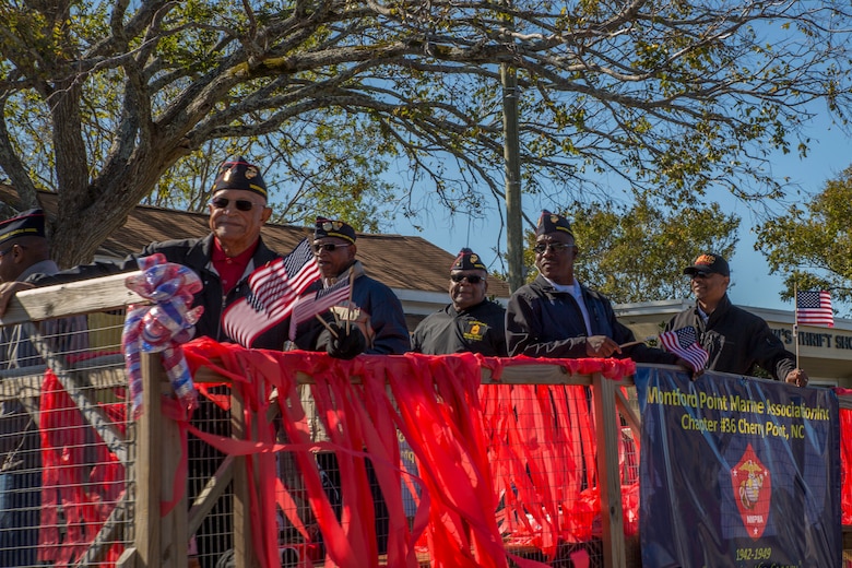 Montford Point Marine veterans participate in the 2019 annual Carteret County Veterans Day Parade in Morehead City, North Carolina, Nov. 9, 2019. The annual observance of Veterans Day gives Americans the opportunity to honor the brave men and women who made the sacrifice to serve their country. Participants of the parade included local politicians, the 2nd Marine Aircraft Wing marching band, the Naval Health Clinic Cherry Point color guard, and local veteran organizations.
