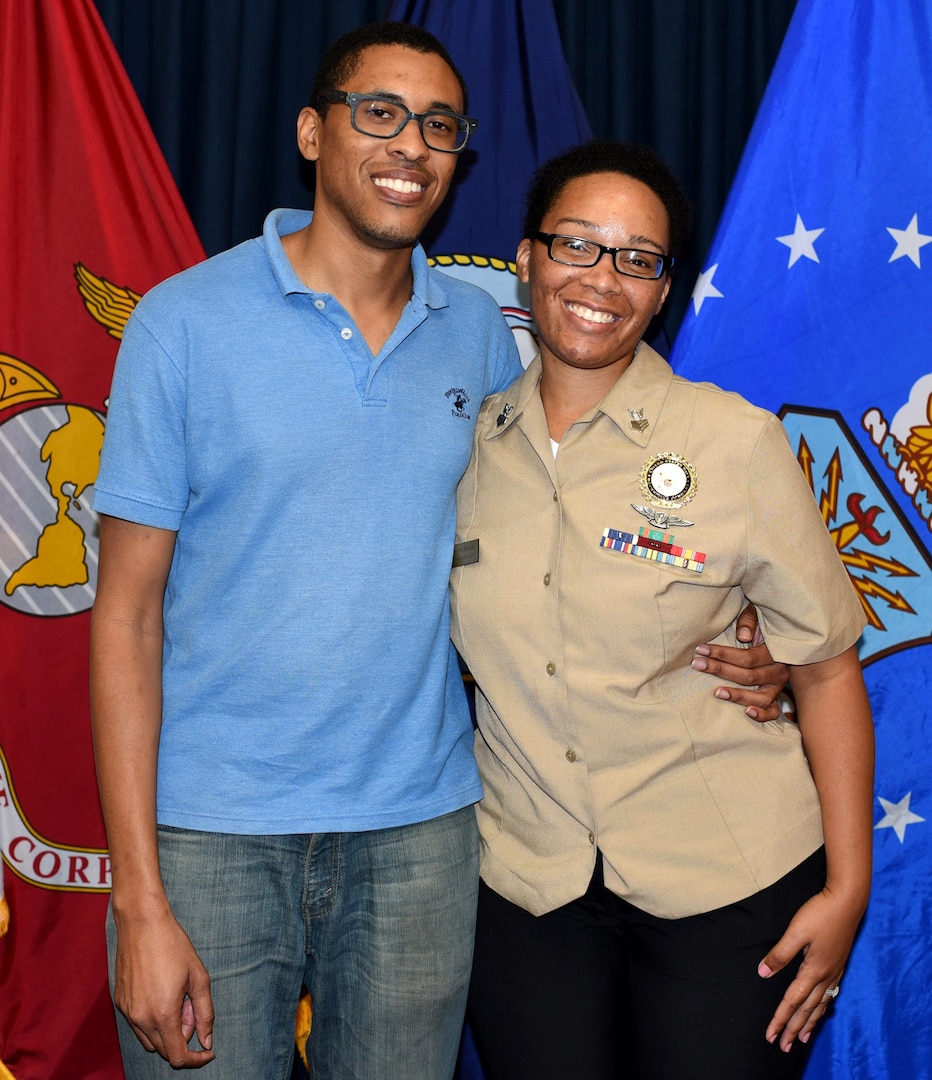 Christopher Delaney of Houston joined America’s Navy during an enlistment ceremony held at the San Antonio Military Entrance Processing Station Oct. 23.  Delaney, who will served in the aviation ordnance career field, is married to Petty Officer 1st Class Kamitria Delaney (right), assigned to Navy Recruiting District San Antonio.