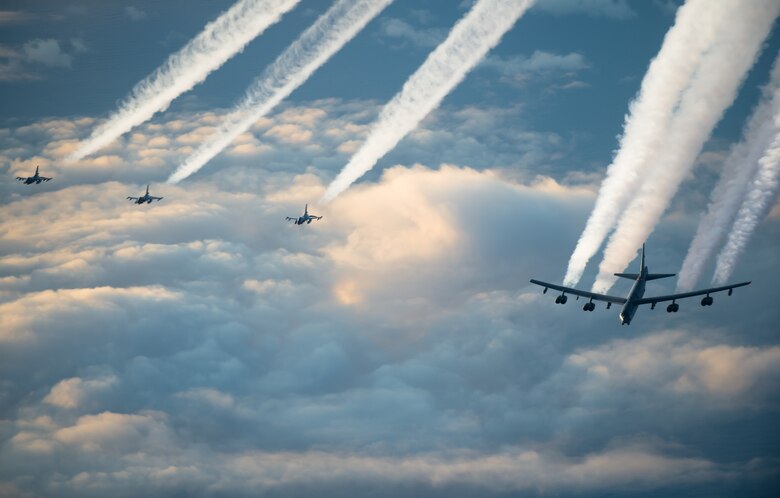 A U.S. Air Force B-52H Stratofortress, assigned to the 2nd Bomb Wing from Barksdale Air Force Base, Louisiana, and three Royal Norwegian Air Force F-16 Fighting Falcons fly together toward the Barents Sea region of the Arctic during Bomber Task Force 20-1, Nov. 6, 2019. This deployment allows aircrews and support personnel to conduct theater integration and improve bomber interoperability with joint partners and allied nations. (U.S. Air Force photo by Staff Sgt. Trevor T. McBride)