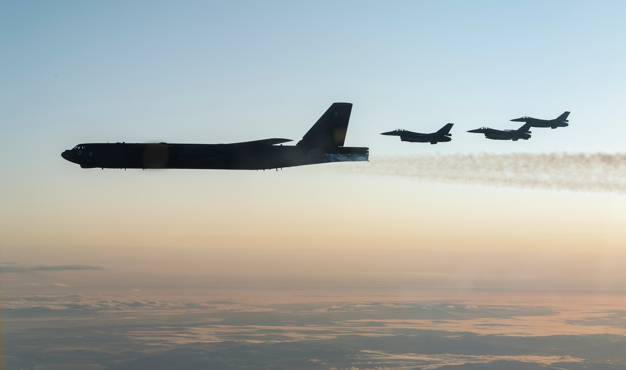 Royal Norwegian Air Force F-16 Fighting Falcons assigned to the 331st Squadron, Bodø Air Force Base, Norway,  fly next to a U.S. Air Force 2nd Bomb Wing B-52H Stratofortress during training and integration with the Norwegian Air Force in support of Bomber Task Force Europe 20-1, Nov. 6, 2019, in Norwegian airspace. This deployment allows aircrews and support personnel to conduct theater integration and to improve bomber interoperability with joint partners and allied nations. (U.S. Air Force photo by Tech. Sgt. Christopher Ruano)