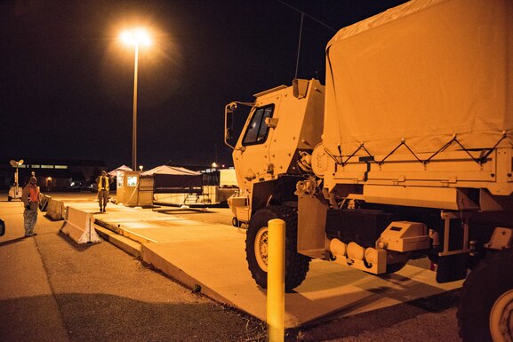 Members from the 436th Airlift Wing begin loading a C-5M Super Galaxy with Delaware National Guard assets during Total Force/Joint Training Exercise Diamond Wing at Dover Air Force Base, Del., Nov. 14, 2019. Units from the DNG Army and Air Guard, along with Active-Duty Air Force personnel and aircraft from Dover AFB worked together to simulate a state-wide disaster response effort. (U.S. Air National Guard Photo by Mr. Mitchell Topal)