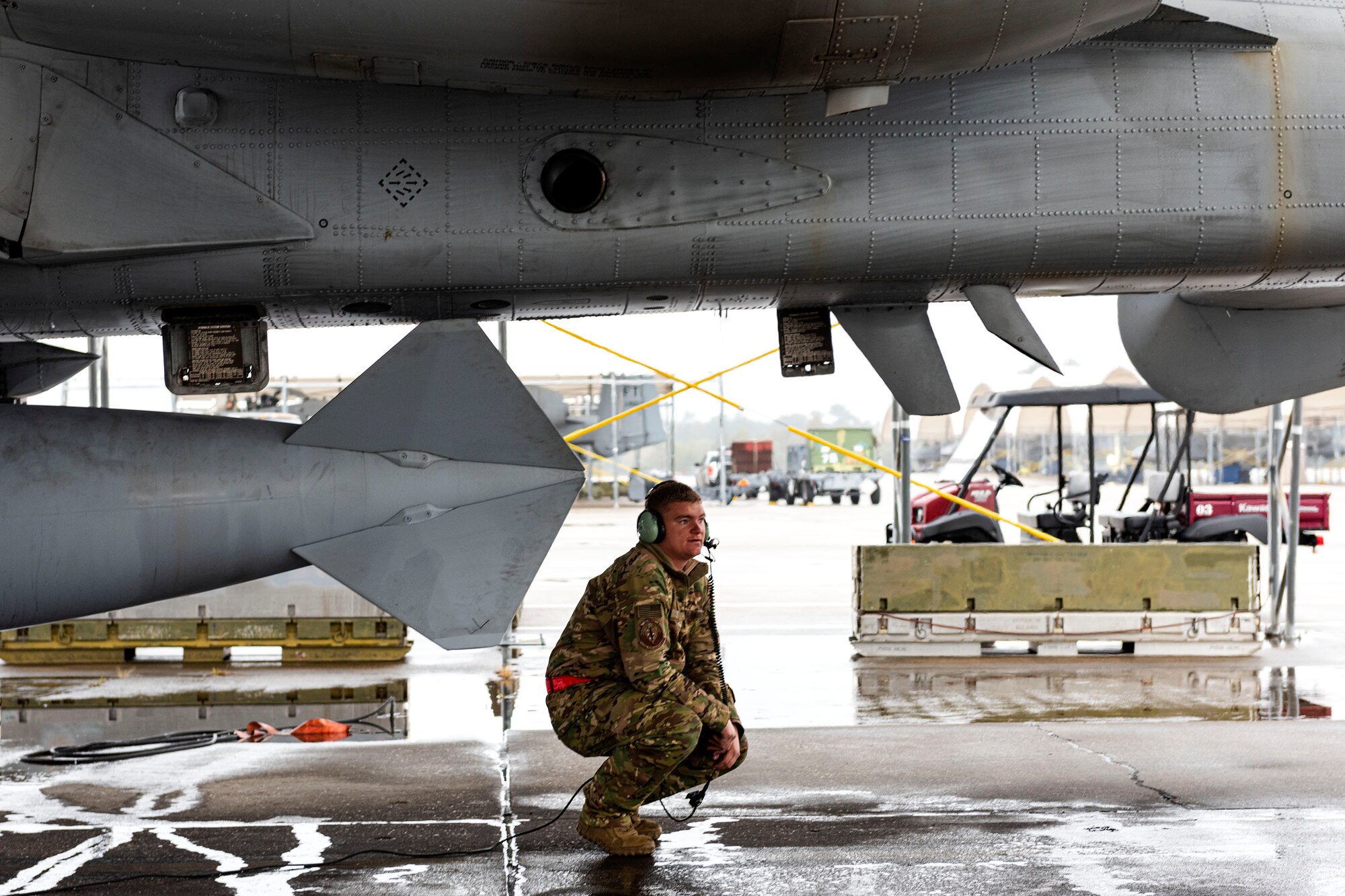 A photo of an Airman performing a pre-flight check.