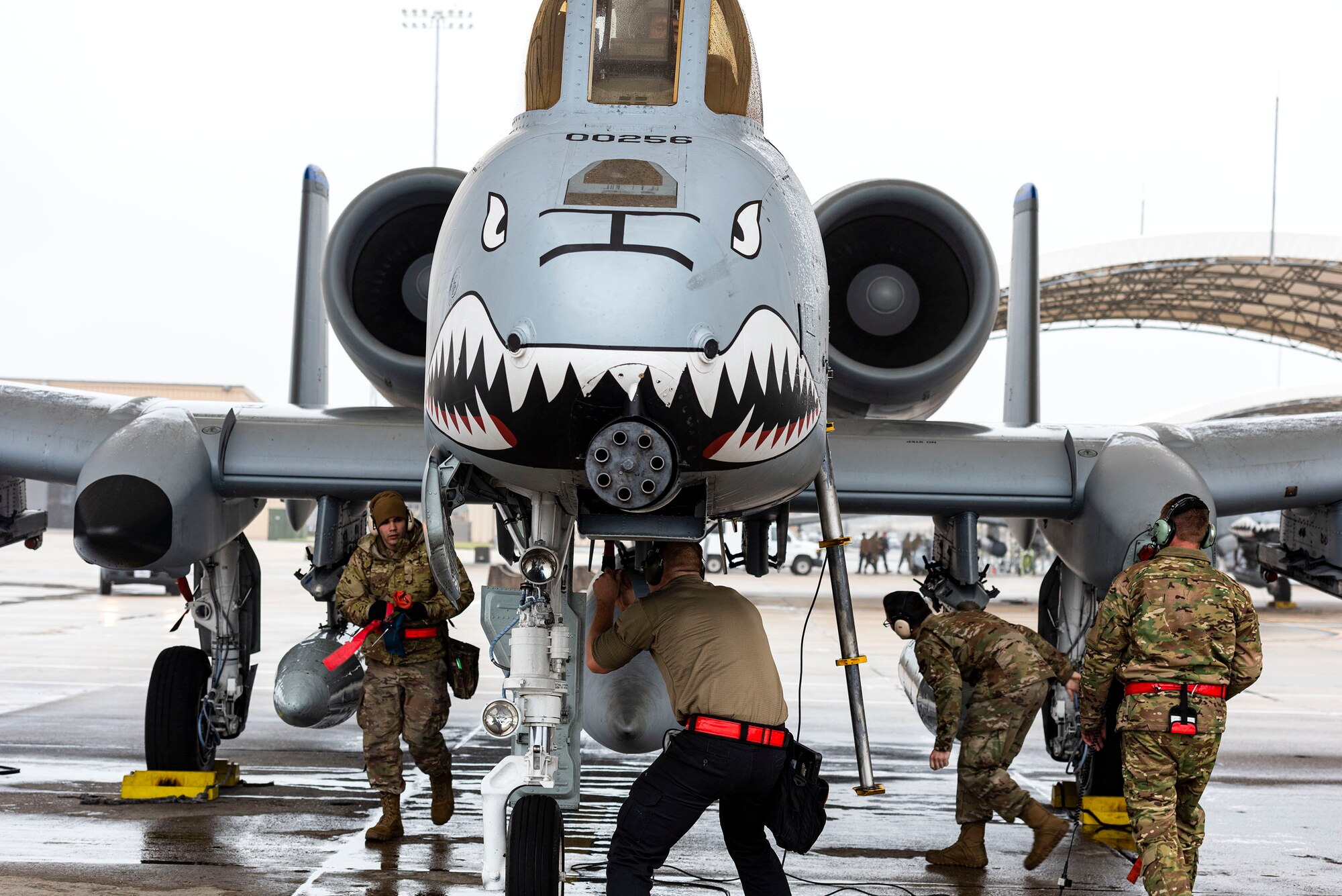A photo of Airmen arming an aircraft.