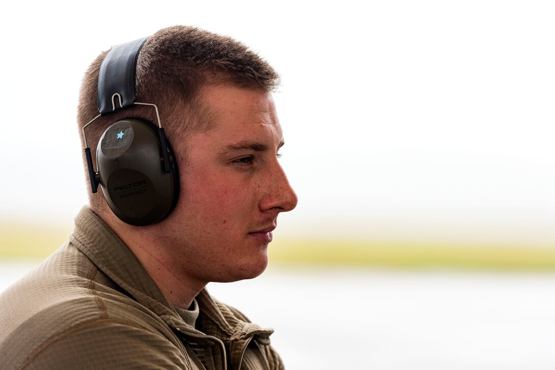 A photo of an Airman waiting for the departure of an aircraft.