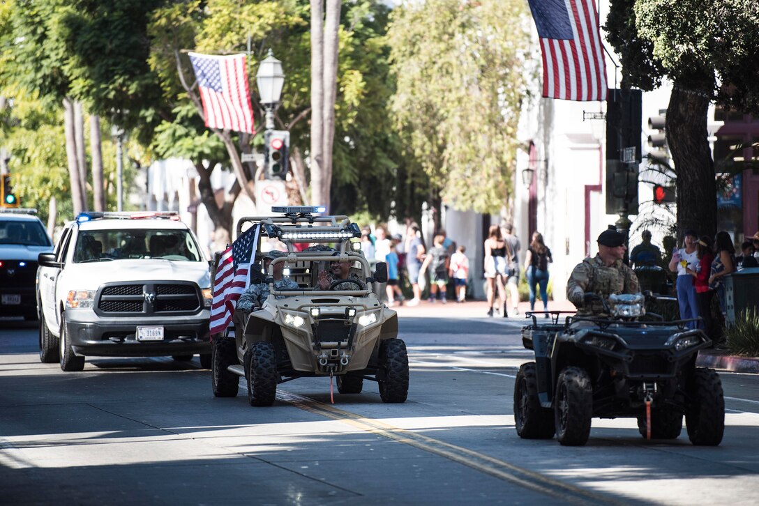 Service members from Vandenberg Air Force Base drive a variety of military vehicles during the Santa Barbara Veterans Day Parade Nov. 9, 2019, in Santa Barbara, Calif. Approximately 116 Airmen from Vandenberg marched in the parade as well as four military working horses, two military working dogs and ten vehicles. (U.S. Air Force photo by Airman 1st Class Hanah Abercrombie)
