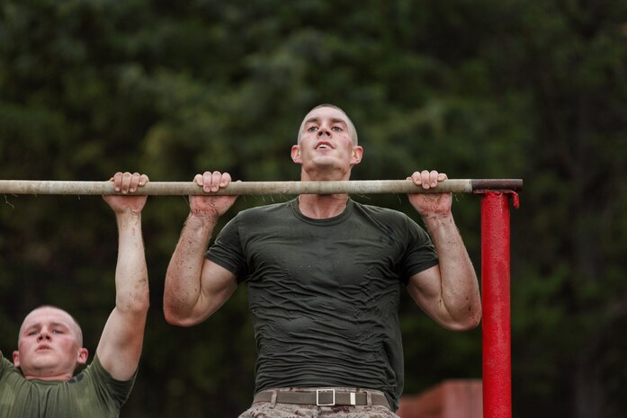 Noah Furbush, 24, a Marine Corps Officer Candidate, conducts pull-ups physical training at Marine Corps Officer Candidates School in Quantico, Virginia, November 5, 2019. The exercise challenges candidates’ ability to navigate on land, give orders and execute the mission effectively. The mission of Officer Candidates School is to educate and train officer candidates in Marine Corps knowledge and skills within a controlled and challenging environment in order to evaluate and screen individuals for the leadership, moral and physical qualities required for commissioning as a Marine Officer.