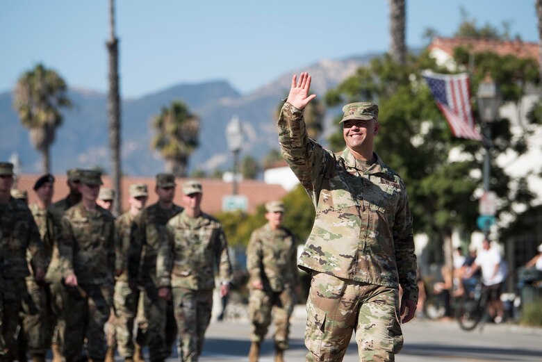 Col. Anthony Mastalir, 30th Space Wing commander, waves during the Santa Barbara Veterans Day Parade Nov. 9, 2019, in Santa Barbara, Calif. Approximately 116 Airmen from Vandenberg marched in the parade as well as four military working horses, two military working dogs and ten vehicles. (U.S. Air Force photo by Airman 1st Class Hanah Abercrombie)