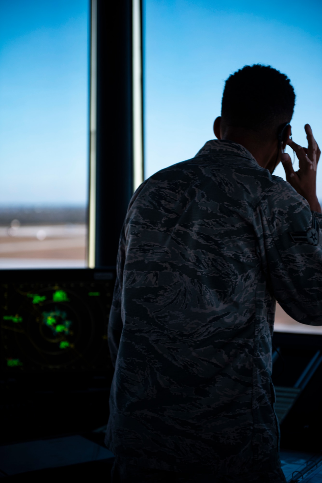 Airman 1st Class Treyzhaun, 325th Operations Support Squadron, air traffic controller, communicates with inbound and outbound pilots trafficking the runway in support of exercise Checkered Flag 20-1 at Tyndall Air Force Base, Florida, Nov. 13, 2019. Checkered Flag is a large-scale exercise involving multiple military partners and installations, designed to focus on training and evaluating fourth and fifth-generation fighter aircraft, pilots and maintainers. In conduction with the exercise, air-to-air and air-to-ground combat operations are tested and recorded to provide data on best practices and ensuring future mission successes. (U.S. Air Force photo by Staff Sgt. Magen M. Reeves)