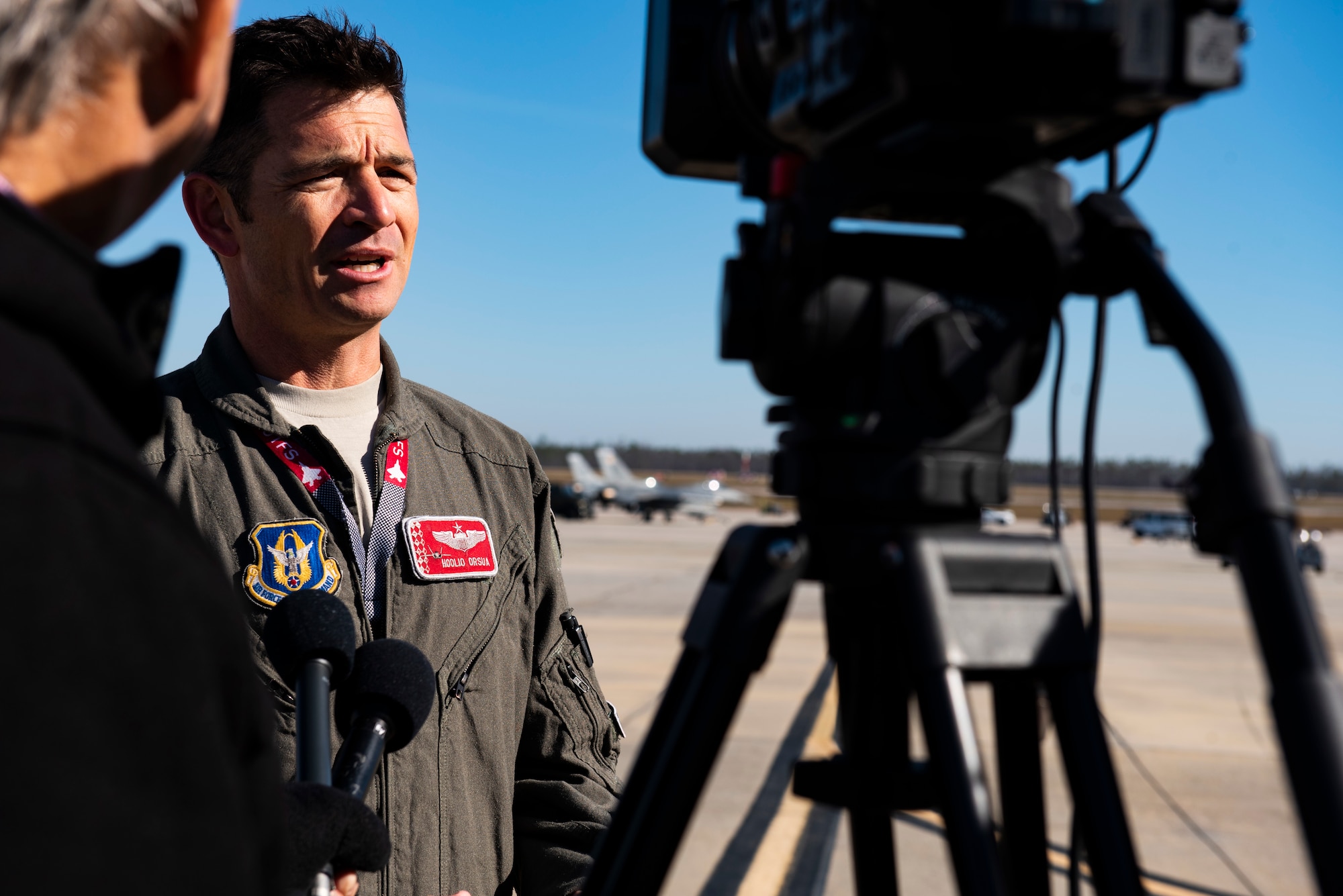 Lt. Col. Benjamin Orsua, Checkered Flag 20-1 exercise director, is interviewed by local media stations at Tyndall Air Force Base, Florida, Nov. 13, 2019. Checkered Flag is a large-scale exercise involving multiple military partners and installations, designed to focus on training and evaluating fourth and fifth-generation fighter aircraft, pilots and maintainers. In conduction with the exercise, air-to-air and air-to-ground combat operations are tested and recorded to provide data on best practices and ensuring future mission successes. (U.S. Air Force photo by Staff Sgt. Magen M. Reeves)