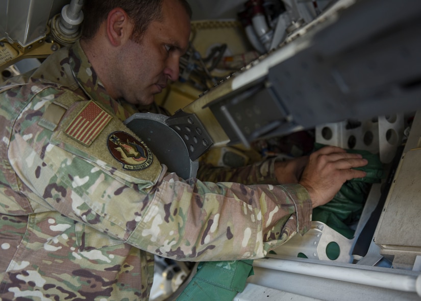 U.S. Air Force Tech. Sgt. Daniel Caban, 1st Aircraft Maintenance Squadron crew chief, packs the Portable Magnetic Aircraft Covers set in an F-22 Raptor at Joint Base Langley-Eustis, Virginia, Oct. 23, 2019.