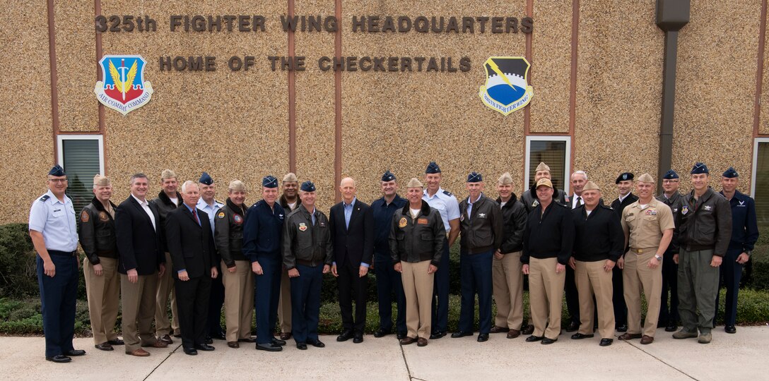 Florida Sen. Rick Scott poses for a group photo outside the 325th Fighter Wing headquarters building with U.S. Air Force Col. Brian Laidlaw, 325th FW commander, and other local military leaders at Tyndall Air Force Base, Florida, Nov. 15, 2019. Scott visited to have an open discussion with base commanders and other military representatives regarding the future of Tyndall. (U.S. Air Force photo by Senior Airman Cheyenne Larkin)
