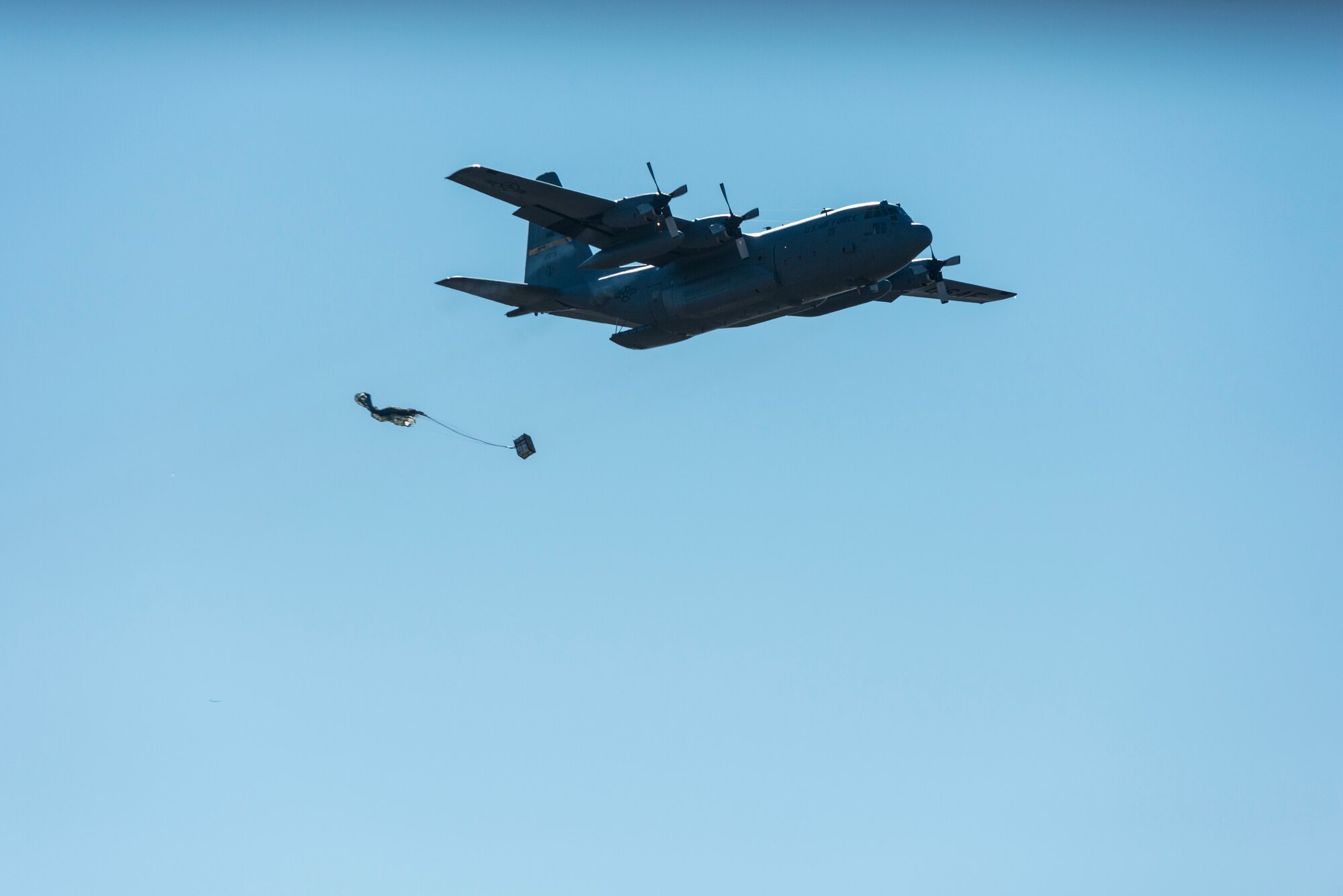 A C-130H Hercules assigned to the 103rd Airlift Wing releases cargo at Westover Air Reserve Base, Chicopee, Mass. Nov. 2, 2019. Local airdrop missions keep 103rd Operations Group aircrews and 103rd Logistics Readiness Squadron air transportation specialists current on their training requirements. (U.S. Air National Guard photo by Airman 1st Class Chanhda Ly)