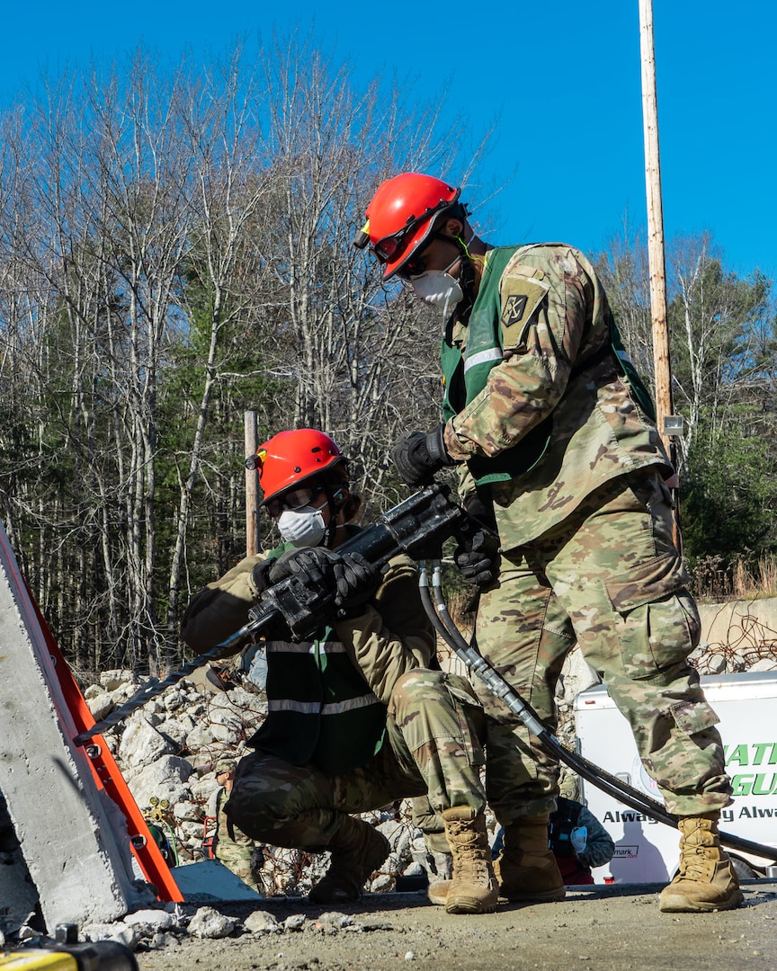 Soldiers with the search-and-extraction element of the New England CERFP practice drilling through concrete while searching for simulated casualties during a Nov. 5-7 collective training exercise in Brunswick, Maine.