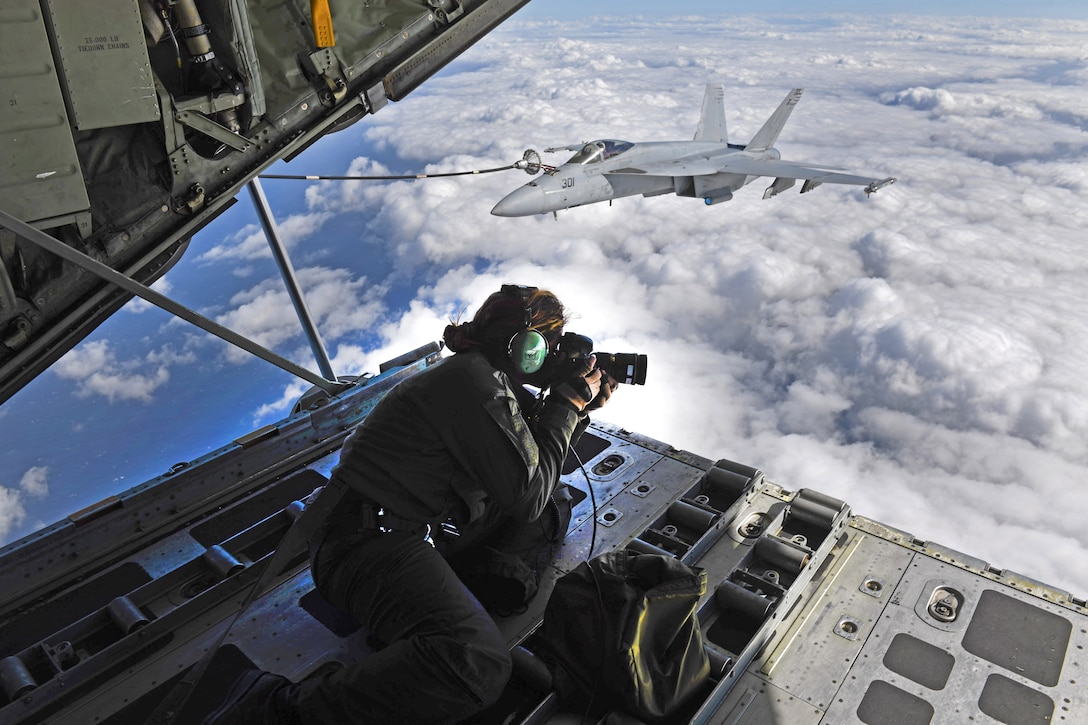 A picture of a photographer with a set of images overlaying the background.