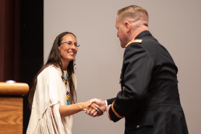 Lt. Col. H. W. Hugh Darville, deputy commander of Huntsville Center, thanks Dr. Yvette Running Horse Collin for speaking during the National American Indian Heritage Month observance at Redstone Arsenal, Alabama, Nov. 13, 2019. The observance was organized by Huntsville Center’s Equal Employment Opportunity office in coordination with Team Redstone and the U.S. Army Aviation and Missile Command. Sacred Way Sanctuary is an education and research facility in Florence, Alabama, dedicated to preserving the Native American horse and other animals sacred to indigenous peoples of the Americas.