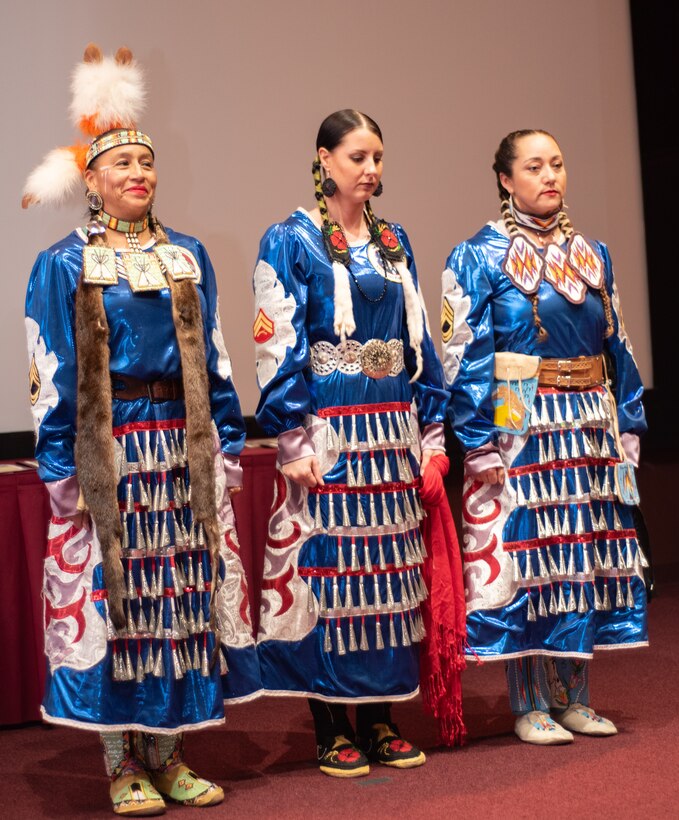 Three members of the Native American Women Warriors stand together at the National American Indian Heritage Month observance at Redstone Arsenal, Alabama, Nov. 13, 2019. From right to left: Army veteran Keshon Smith; Marine Corps veteran Carrie Lewis; and Army veteran Mitchelene BigMan, president and founder of NAWW. The observance was organized by Huntsville Center’s Equal Employment Opportunity office in coordination with Team Redstone and the U.S. Army Aviation and Missile Command. The Native American Women Warriors are an all-female group of Native American veterans who started as a color guard but have since grown and branched out as advocates for Native American women veterans in areas such as health, education and employment. The members make appearances at various events around the country, serving as motivational and keynote speakers, performing tribal dances, and fulfilling the role of color guard representing all branches of the U.S. military.