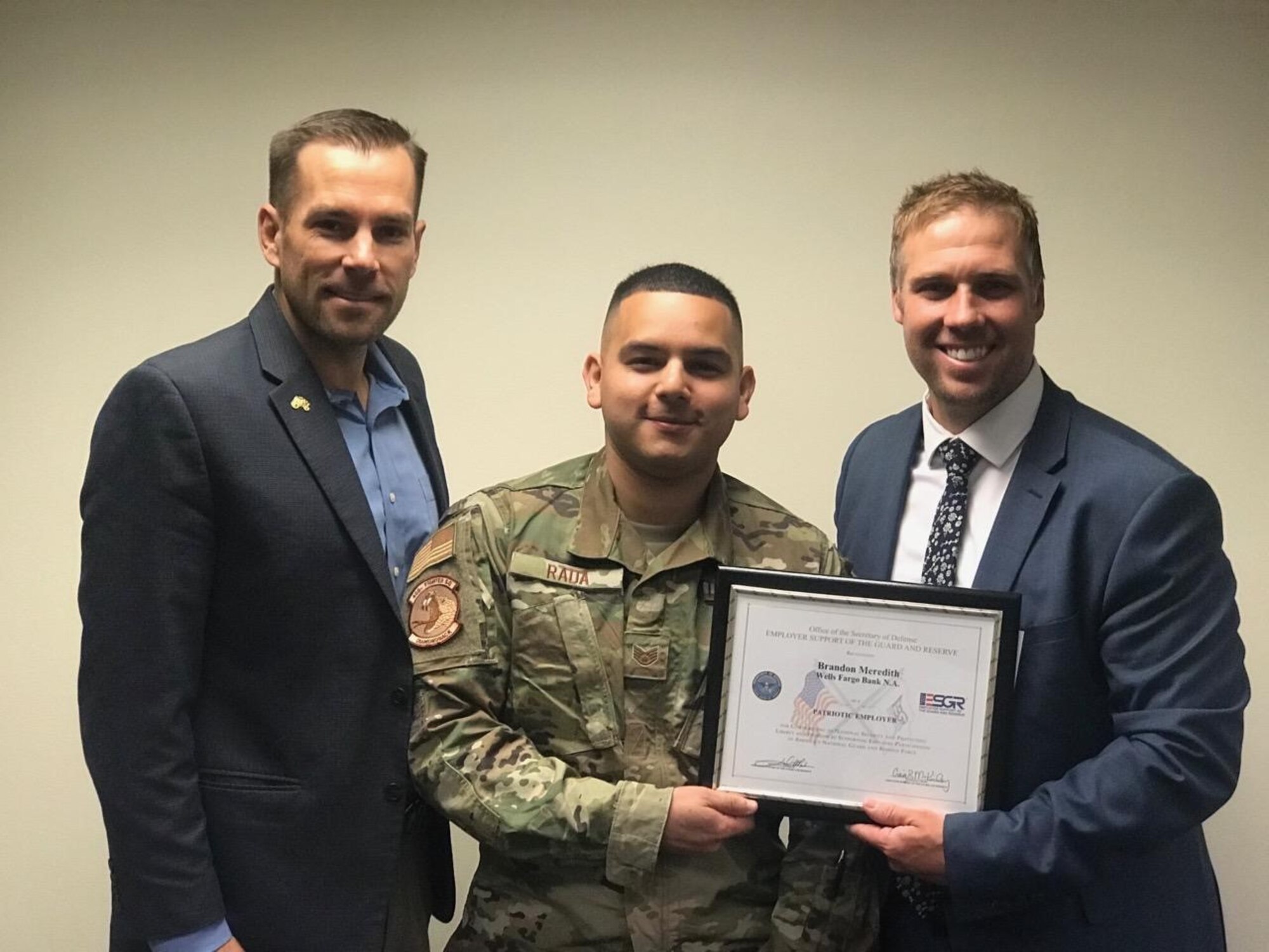 Staff Sgt. Ricky Rada, a reservist in the 419th Operations Group, poses with his civilian employer, Brandon Meredith