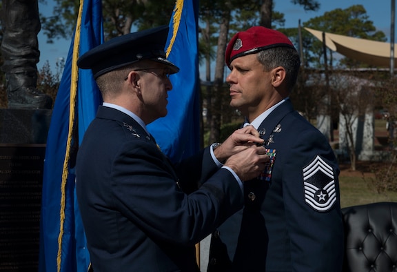 U.S. Air Force Lt. Gen. Jim Slife, commander of Air Force Special Operations Command, pins the Silver Star Medal onto U.S. Air Force Chief Master Sgt. Chris Grove, a Special Tactics combat controller assigned as the 720th Special Tactics Group superintendent, during a ceremony at Hurlburt Field, Florida, Nov. 15, 2019. Grove was awarded the nation’s third highest medal against an armed enemy of the United States in combat for his actions while deployed to Afghanistan in November 2007. Grove was originally awarded the Bronze Star with Valor, but his award package was reviewed and resubmitted for an upgrade. (U.S. Air Force photo by Senior Airman Rachel Williams)