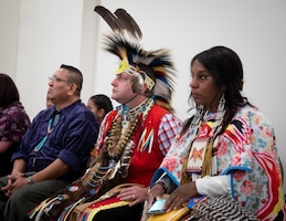 Red Road Awareness performers Fred Keams, Joshua McMinn, and Nina Fox,  listen to guest speaker Chief Matthew Black Eagle Man during the Fort Knox National American Indian Heritage Month Observance, hosted by 1st Theater Sustainment Command at Saber and Quill on Fort Knox, Ky., Nov. 15, 2019.
