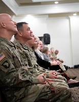 Distinguished guests hold their braids of sweet grass while listening to a speech delivered by the guest speaker Chief Black Eagle Man during the Fort Knox National American Indian Heritage Month Observance hosted by 1st Theater Sustainment Command on Fort Knox, Ky., Nov. 15, 2019.