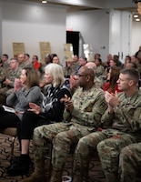Distinguished guests clap after a performance during the Fort Knox National American Indian Heritage Month Observance held at Saber and Quill on Fort Knox, Ky. Nov. 15, 2019.