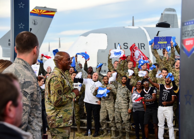Airmen, family, and veterans cheer during ESPN's 