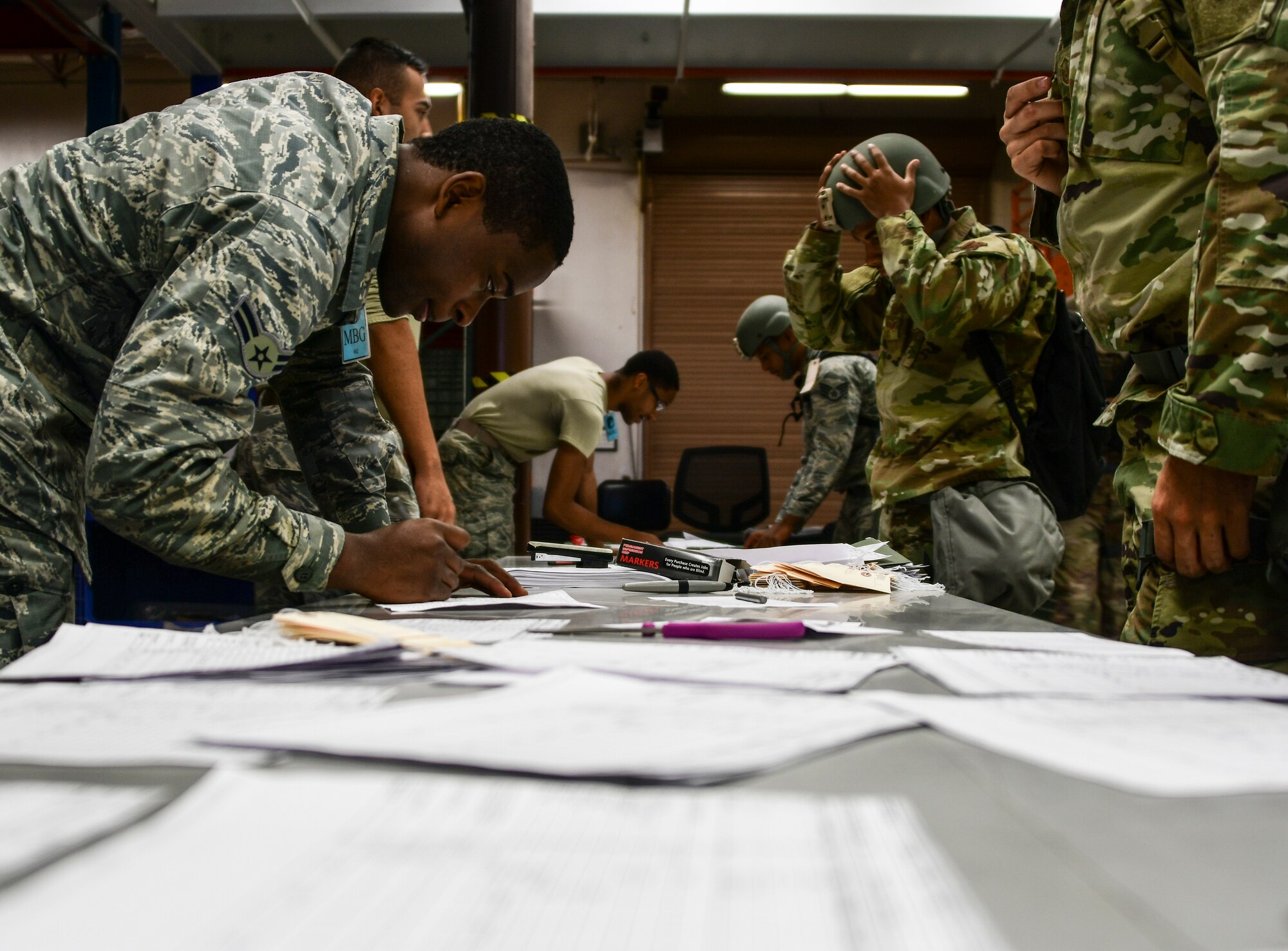 A photo of airmen in a personnel deployment function line prepping for the Dynamic Wing exercise.