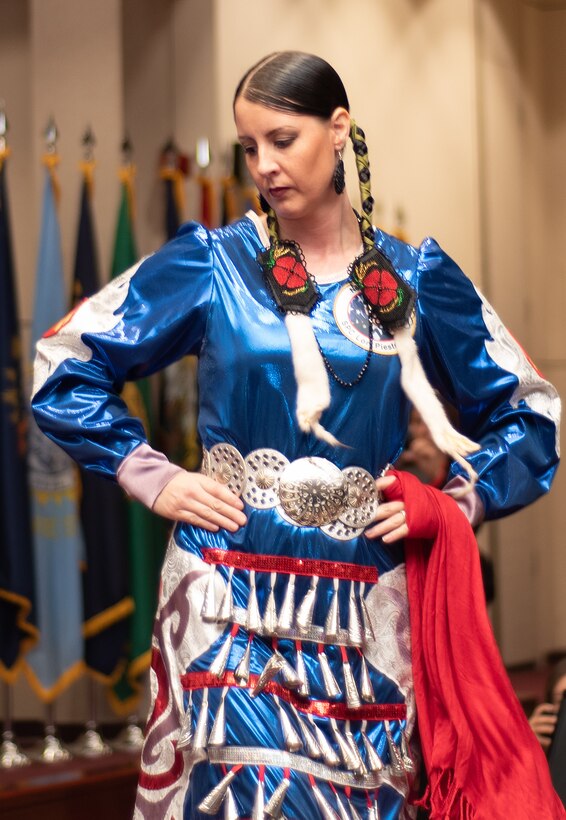 Marine Corps veteran Carrie Lewis performs a tribal dance for attendees of the National American Indian Heritage Month observance at Redstone Arsenal, Alabama, Nov. 13, 2019. Lewis is a member of the Native American Women Warriors, an all-female group of Native American veterans who started as a color guard but have since grown and branched out as advocates for Native American women veterans in areas such as health, education and employment. The warriors make appearances at various events around the country, serving as motivational and keynote speakers, performing tribal dances, and fulfilling the role of color guard representing all branches of the U.S. military.