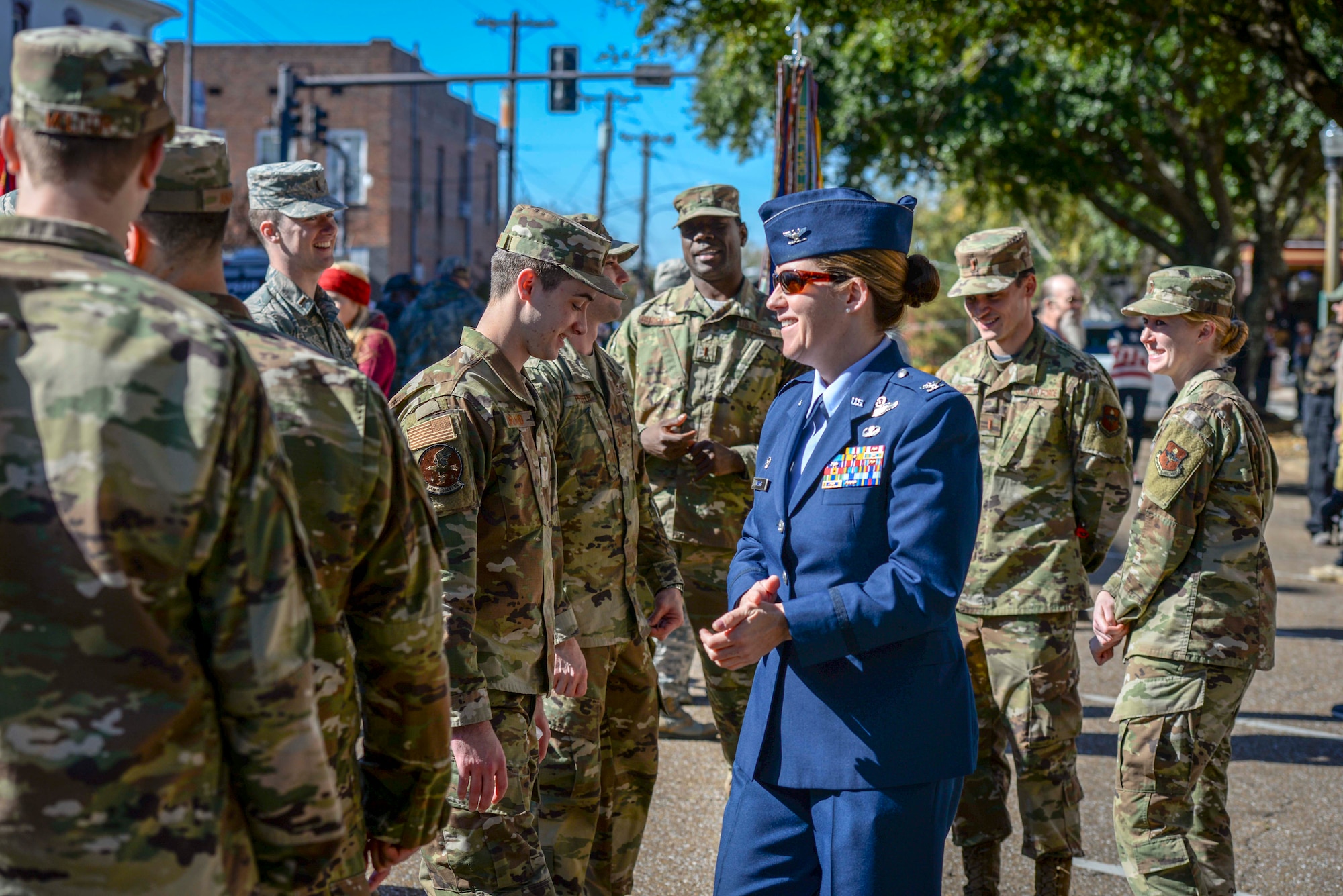 Col. Samantha Weeks, 14th Flying Training Wing commander at Columbus Air Force Base, Miss. talks with Airmen prior to the Columbus Veterans Day Ceremony Nov. 9, 2019, in Columbus, Miss. Weeks was one of the members who laid a wreath in front of the Lowndes County Courthouse in Columbus, Miss. (U.S. Air Force photo by Tech. Sgt. Christopher Gross)