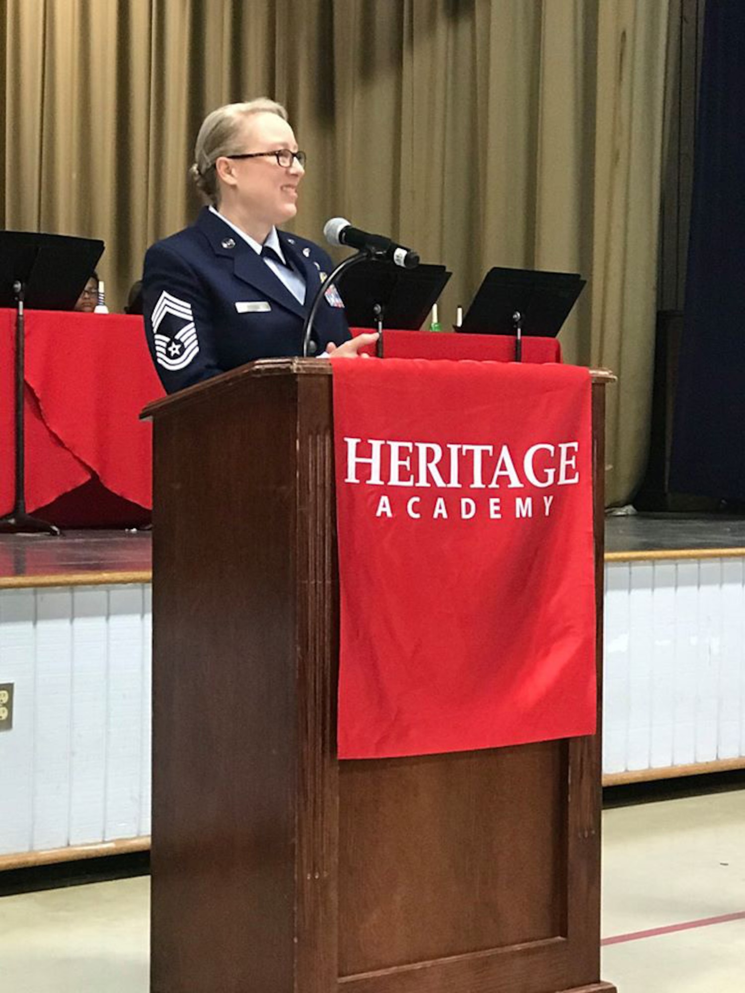 Chief Master Sgt. Kellie Brisse, 14th Operations Group superintendent, speaks to students at Heritage Academy in Columbus, Miss., Nov. 11, 2019. Brisse spoke about the importance of honoring veterans and how they blend in all throughout society. (U.S. Air Force photo by Kristina Conwill)