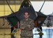 U.S. Air Force Tech. Sgt. Daniel Caban, 1st Aircraft Maintenance Squadron crew chief, stands in front of an F-22 Raptor at Joint Base Langley-Eustis, Virginia, Oct. 23, 2019.
