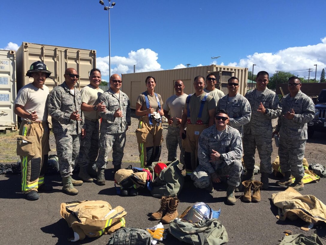 U.S. Air Force Reserve members with the 624th CES firefighting team, along with 624th Regional Support Group and squadron leadership, participate during hands-on training Nov. 2 at the Joint Base Pearl Harbor-Hickam Fire Department Training Area. The required annual external Aircraft Rescue Firefighting training scenario prepares firefighter teams for real-world responses and missions. (U.S. Air Force courtesy photo)