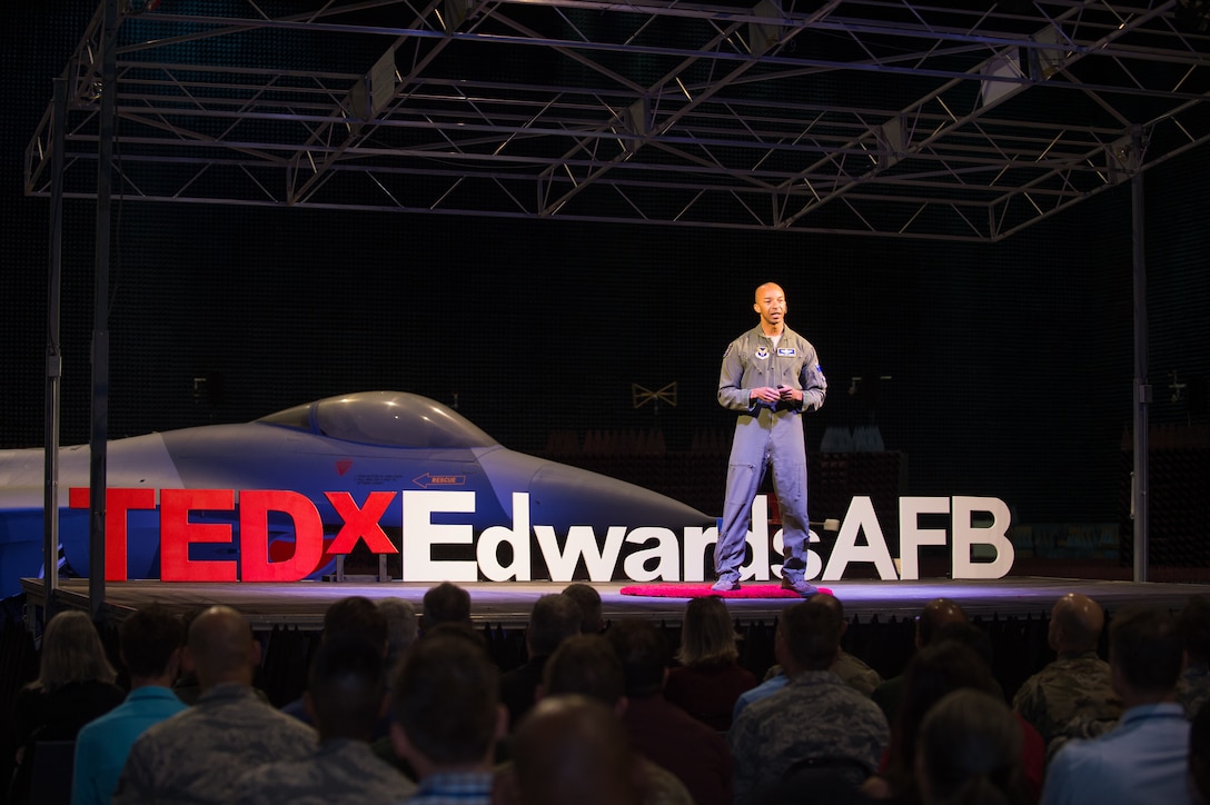 Col. Randy “Laz” Gordon, Lead for the Secretary of the Air Force’s AI Technology Accelerator, talks to guests during a presentation at the Edwards Air Force Base first-ever TEDx talks in the Benefield Anechoic Facility at Edwards AFB, California, Nov. 12. Gordon shared his experiences on innovation, implementation and breaking barriers while serving in the Air Force. Technology, Entertainment, and Design (TED) is a nonpartisan nonprofit devoted to spreading ideas, usually in the form of short, powerful talks. Meanwhile, TEDx events are organized independently under a free license granted by TED, according to the TED website. (Air Force photo by Richard Gonzales)