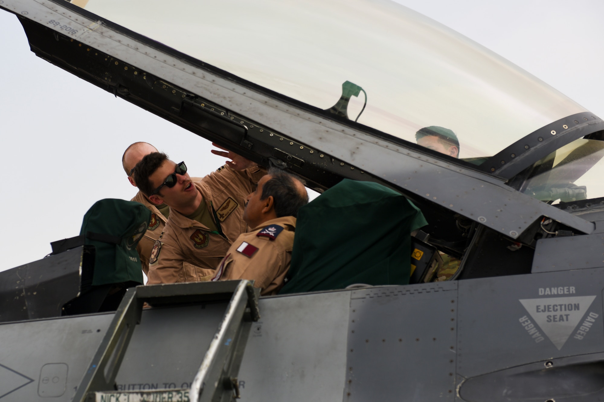 U.S. Air Force pilots show Staff MG Pilot Salem Bin Hamad Al-Nabet, Commander of the Qatar Emiri Air Force, the cockpit of a U.S. Air Force F-16 Fighting Falcon during a visit to Al Udeid Air Base Qatar, Nov 10, 2019.