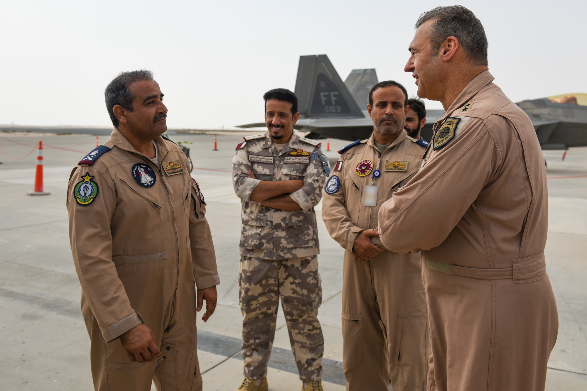 The Commander of the Qatar Emiri Air Force, Staff MG Pilot Salem Bin Hamad Al-Nabet, and other senior leaders, converse with Lt. General Joseph Guastella, U.S. Air Forces Central Command Commander Falcon during a visit to Al Udeid Air Base Qatar, Nov 10, 2019.