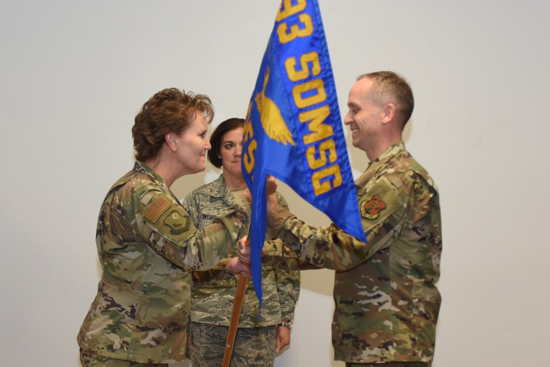 U.S. Air Force Col. Susan Garrett, 193rd Special Operations Mission Support Group commander, left, passes a guidon to Lt. Col. Frank Shoaf, the commander of the 193rd Force Support Squadron, during an assumption of command ceremony Nov. 16, 2019, Middletown, Pennsylvania. The ceremony began with preliminary honors and ended with the symbolic passing of the guidon. Shoaf previously served as the combat plans division operations officer and strategy planner, with the 193rd Combat Operations Squadron, State College, Pennsylvania. (U.S. Air National Guard photo by Tech. Sgt. Claire Forbes)