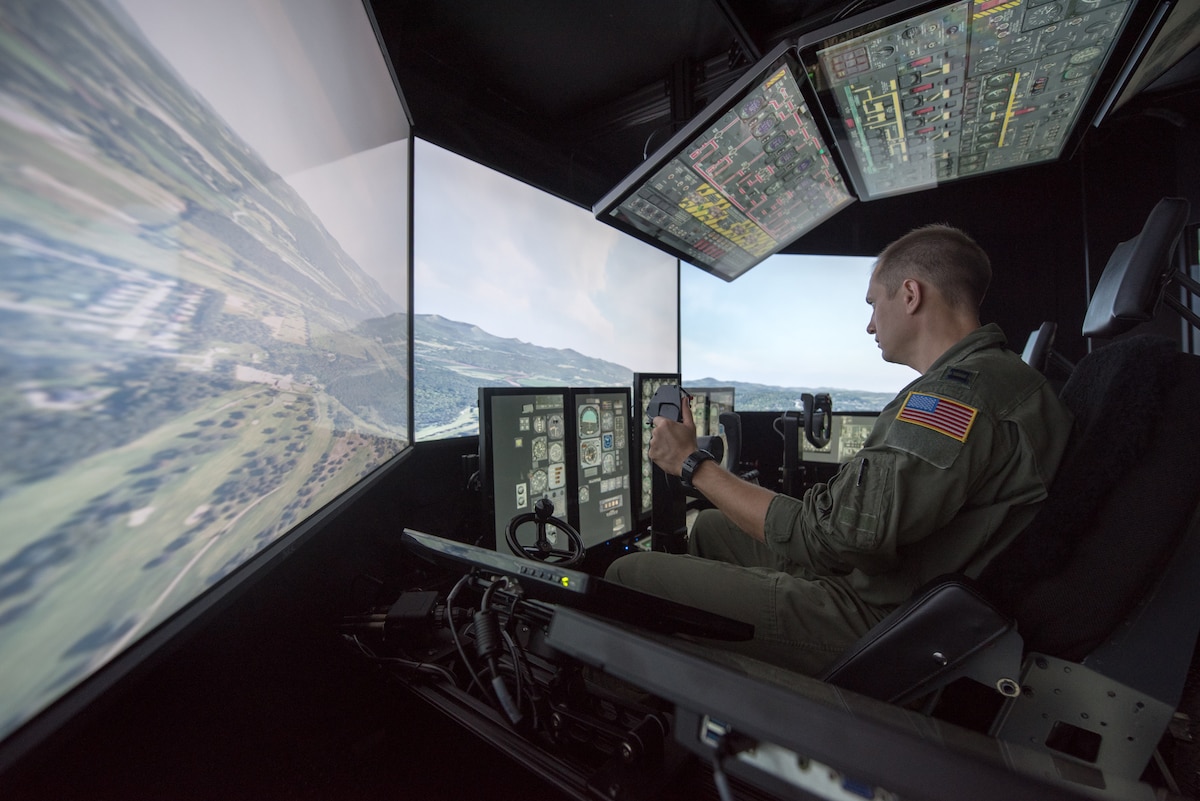 Capt. Tristan Stonger, a pilot from the Kentucky Air National Guard’s 165th Airlift Squadron, uses a C-130 simulator for training at the Kentucky Air National Guard Base in Louisville, Ky., Aug. 28, 2019. Known as the Multi-Mission Crew Trainer, the system helps prepare Airmen for handling in-flight emergencies. (U.S. Air National Guard photo by Phil Speck)